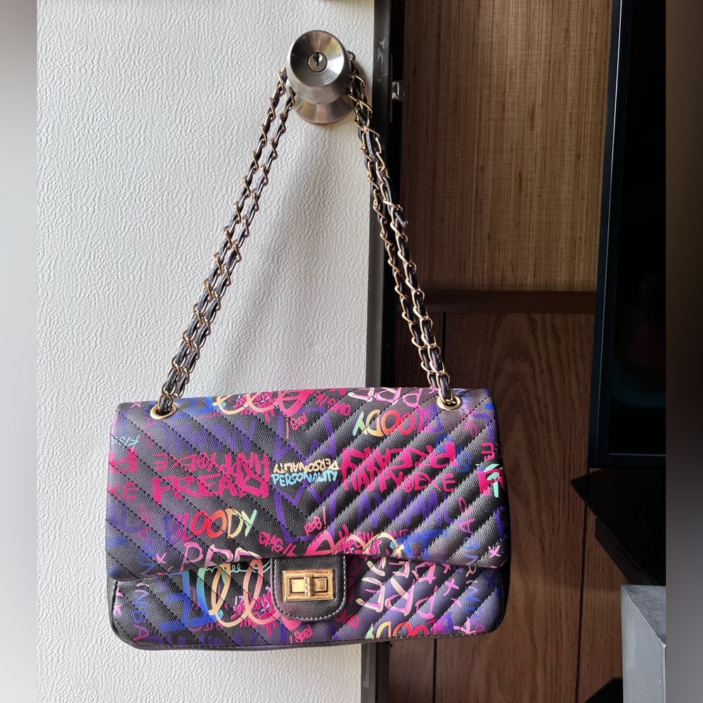 Medium Graffiti Quilted Shoulder
Handbag With Chain Shoulder Straps.